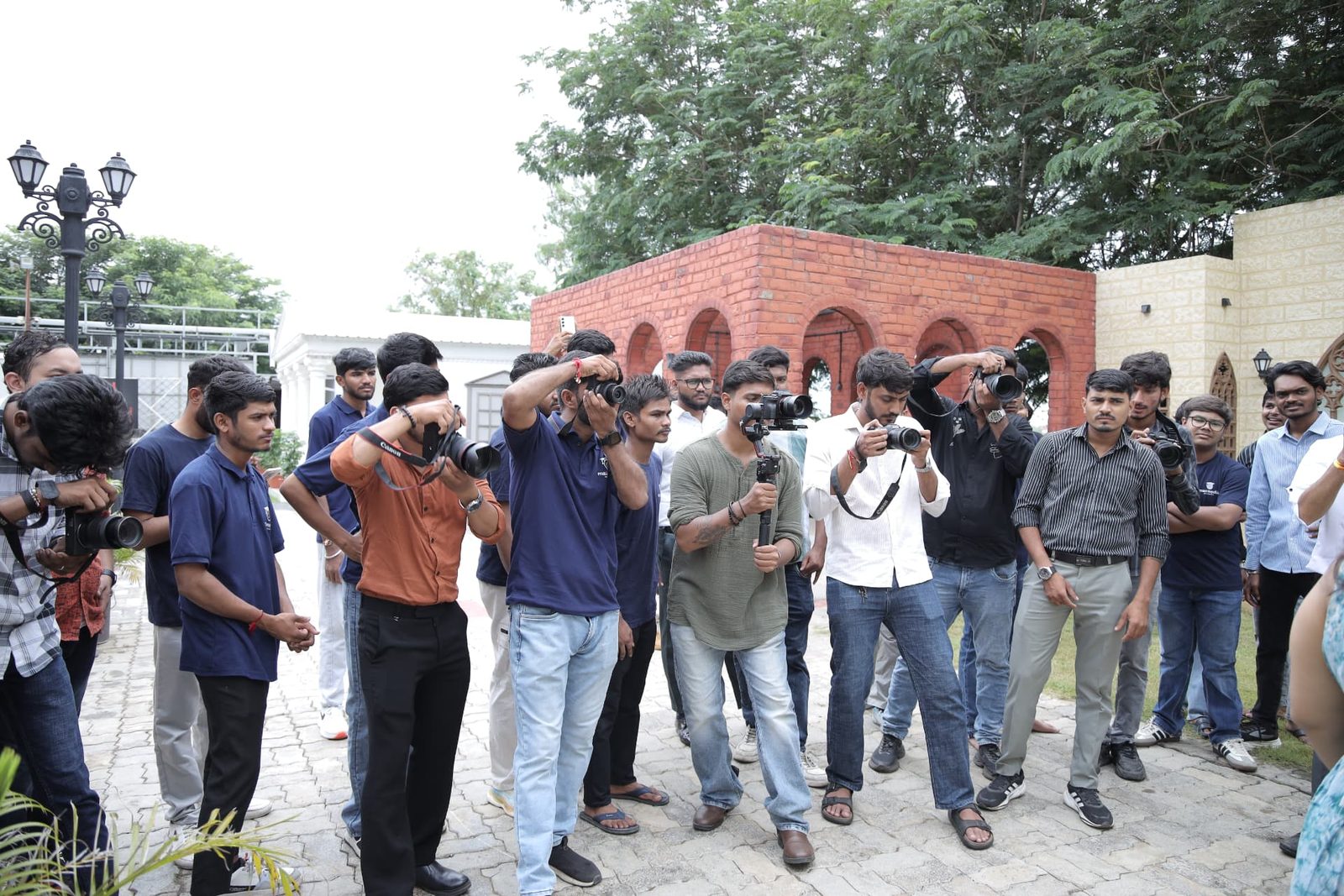 Students practicing photography during an outdoor workshop